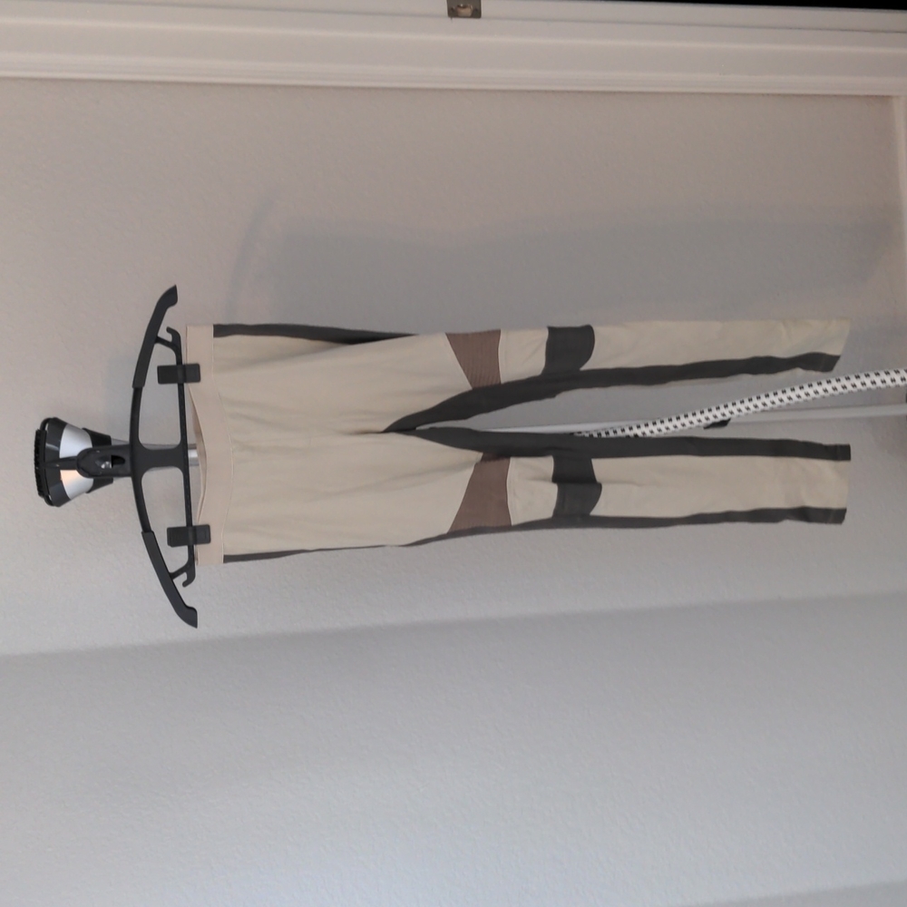 BCBG tan leggings with neutral colored stripes size small
